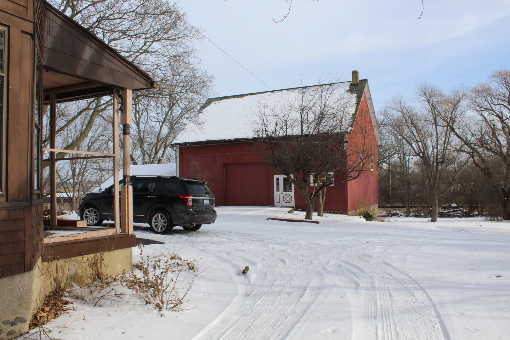 1245 Main Street Antioch, IL 60002 - Photo 37 of 44 a car parked in front of a house