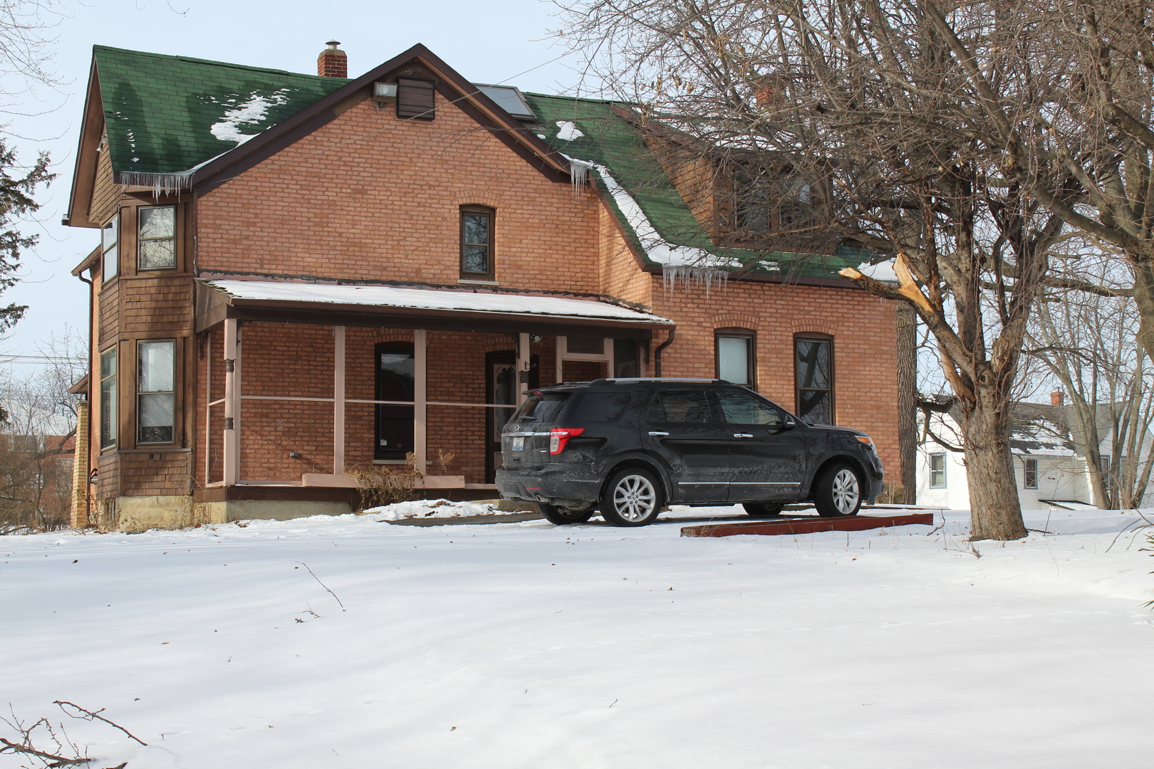 1245 Main Street Antioch, IL 60002 - Photo 5 of 44 a car parked in front of a house