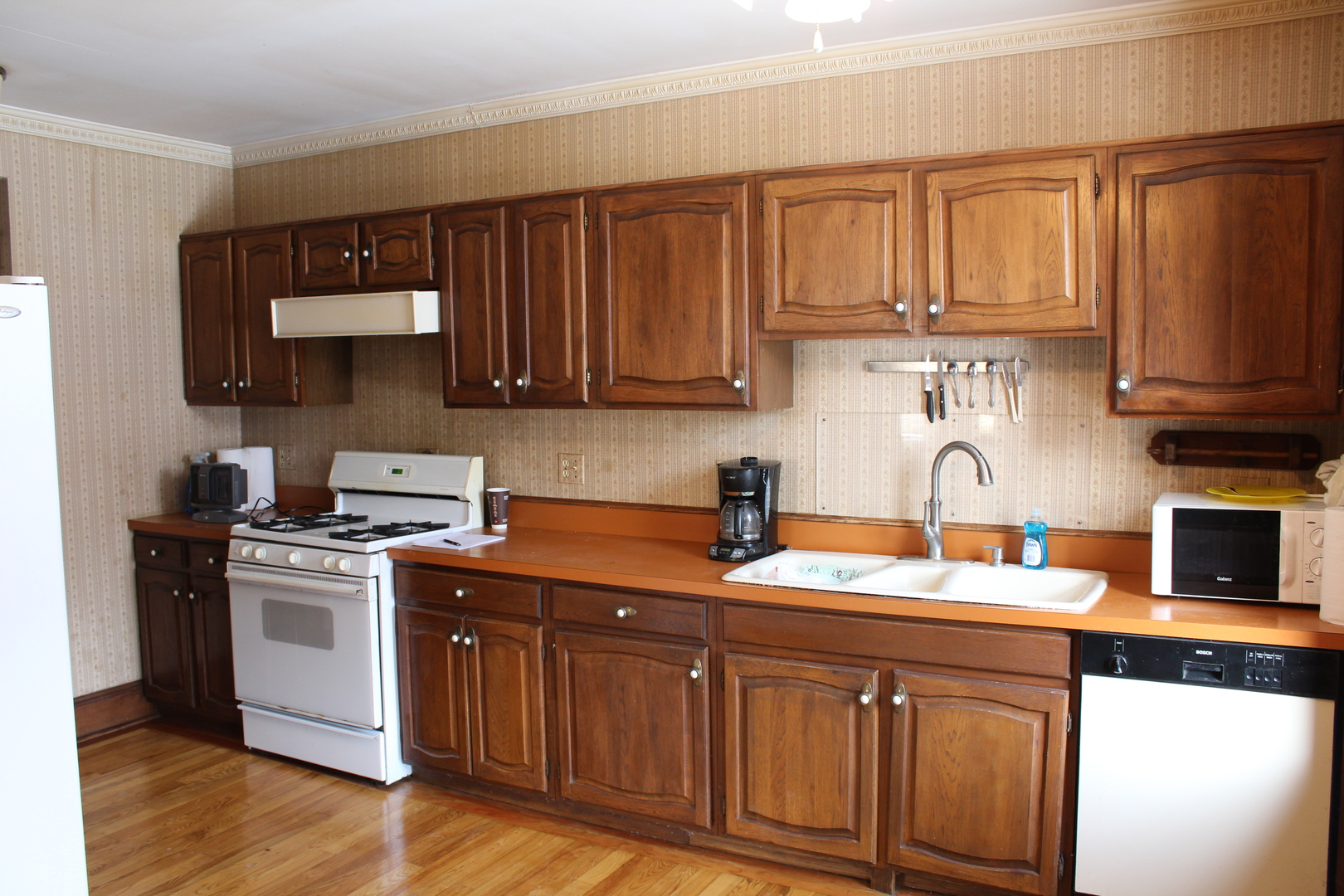 1245 Main Street Antioch, IL 60002 - Photo 7 of 44 a kitchen with stainless steel appliances granite countertop a sink stove and cabinets