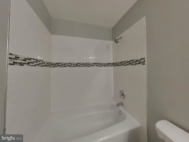 a bathroom with a shower and a bathtub
