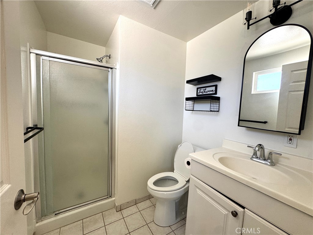2065 Morley Street Simi Valley, CA 93065 - Photo 11 of 13 a bathroom with a sink toilet and shower