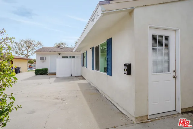 a view of a house with backyard and garage