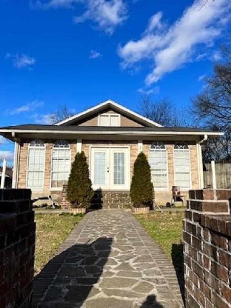3564 Kendrick Road Memphis, TN 38108 - Photo 1 of 2 a front view of a house with a yard