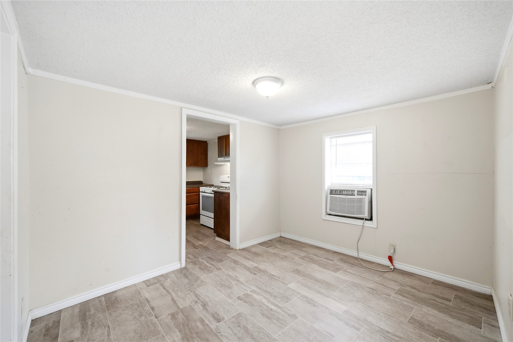 101 Outlar Street Wharton, TX 77488 - Photo 6 of 40 an empty room with windows and closet