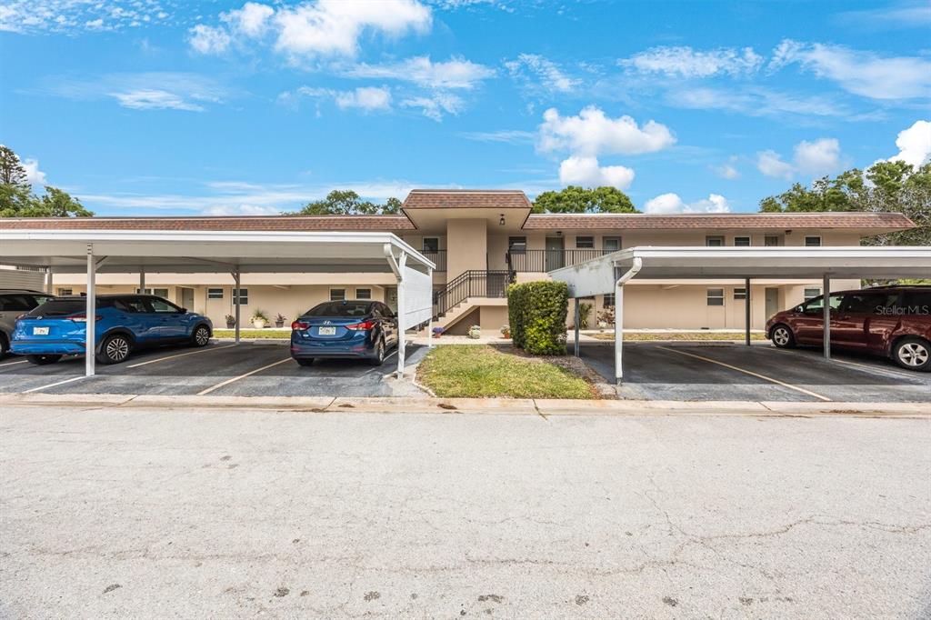 9945 47th Avenue North, Unit 203 St. Petersburg, FL 33708 - Photo 2 of 29 a view of parking