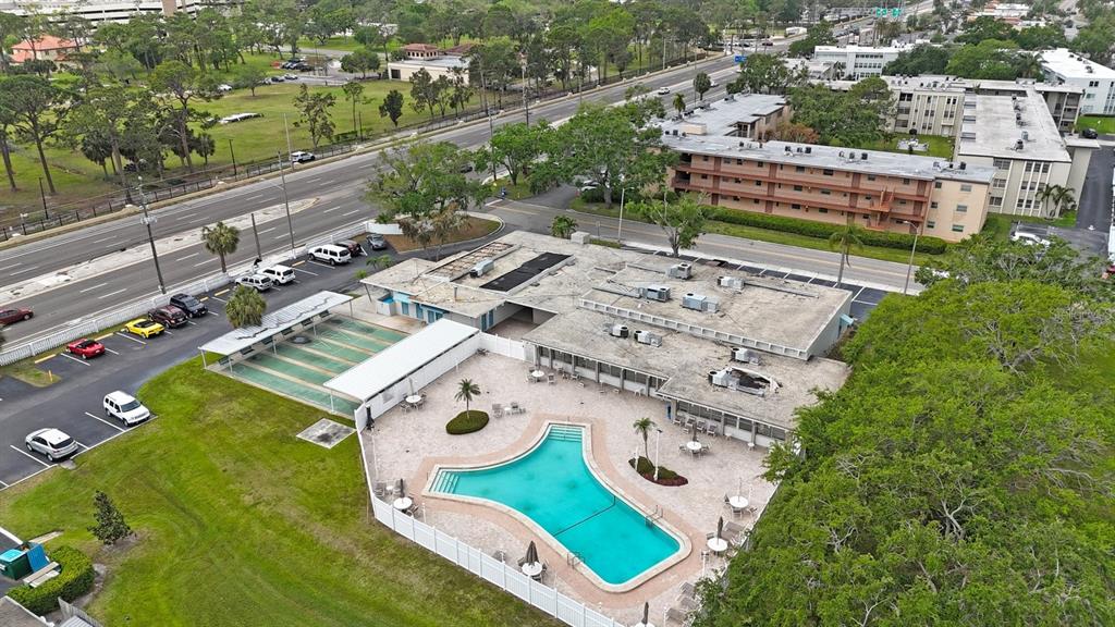 9945 47th Avenue North, Unit 203 St. Petersburg, FL 33708 - Photo 25 of 29 an aerial view of a house with a yard