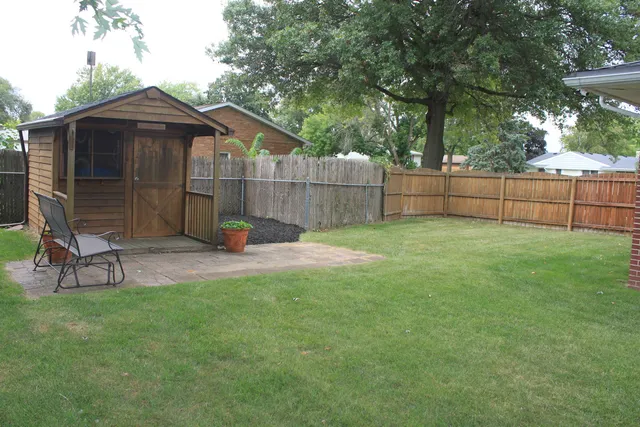 a view of a house with a yard porch and sitting area