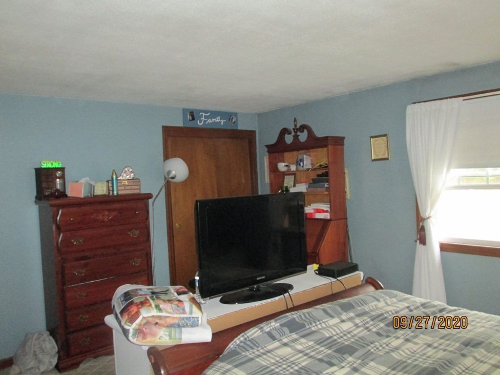 66 South Road Londonderry, NH 03053 - Photo 11 of 21 a bedroom with a bed and a television