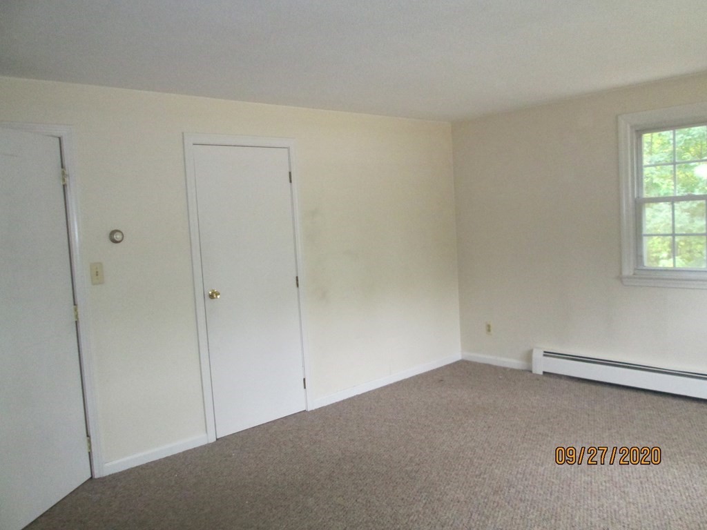 66 South Road Londonderry, NH 03053 - Photo 19 of 21 a view of an empty room and a window