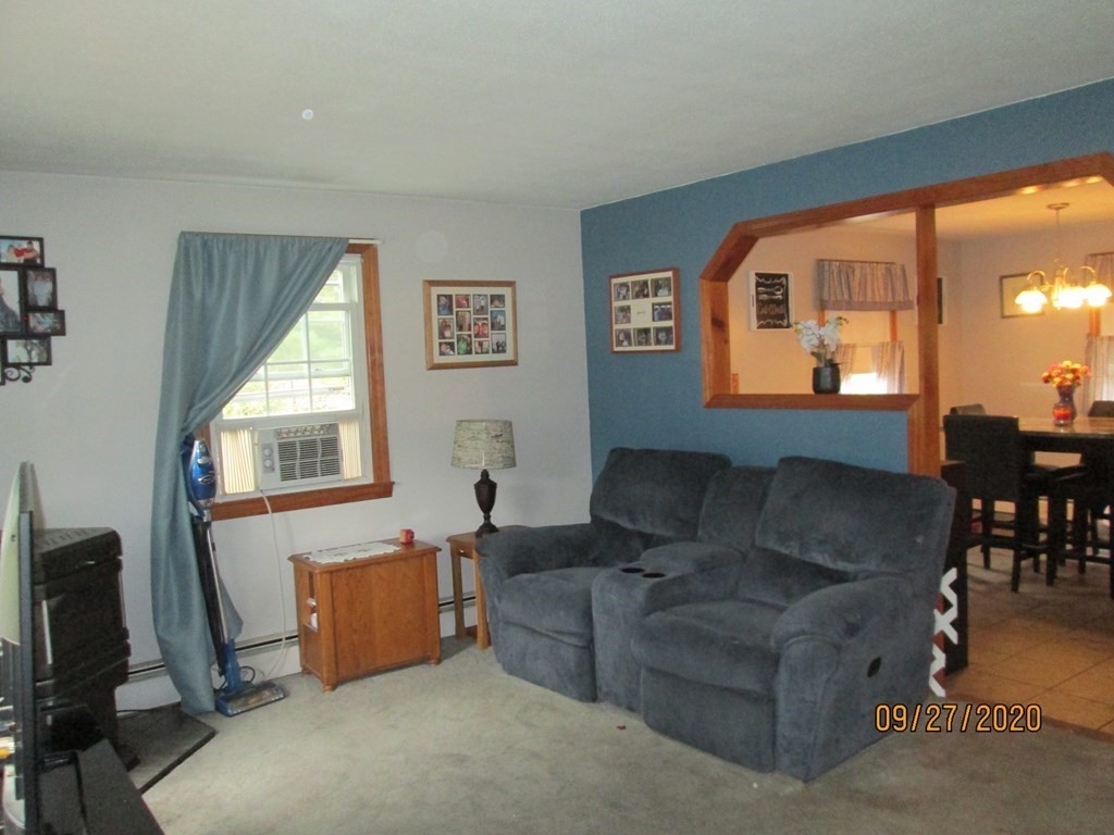 66 South Road Londonderry, NH 03053 - Photo 8 of 21 a living room with furniture and a window