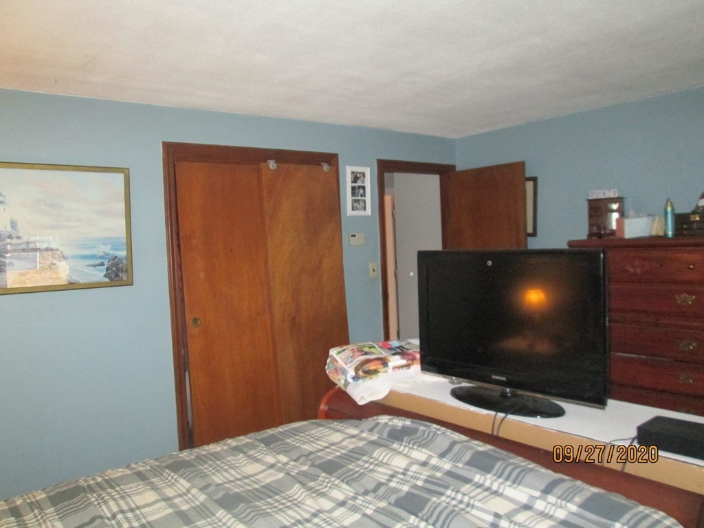 66 South Road Londonderry, NH 03053 - Photo 10 of 21 a bedroom with a bed and a flat screen tv