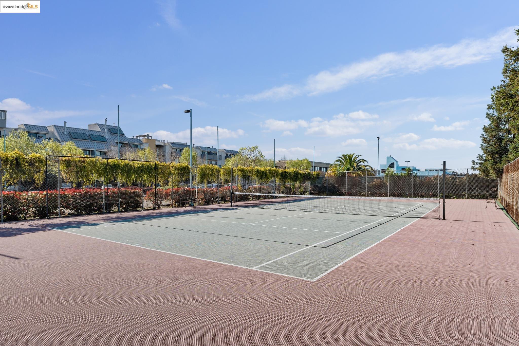 1 Embarcadero, Unit 161 Oakland, CA 94607 - Photo 12 of 31 View of tennis court featuring community basketball court