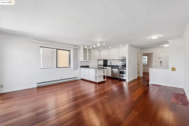 a view of kitchen with furniture and wooden floor