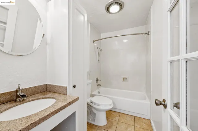 a kitchen with granite countertop a stove and a sink