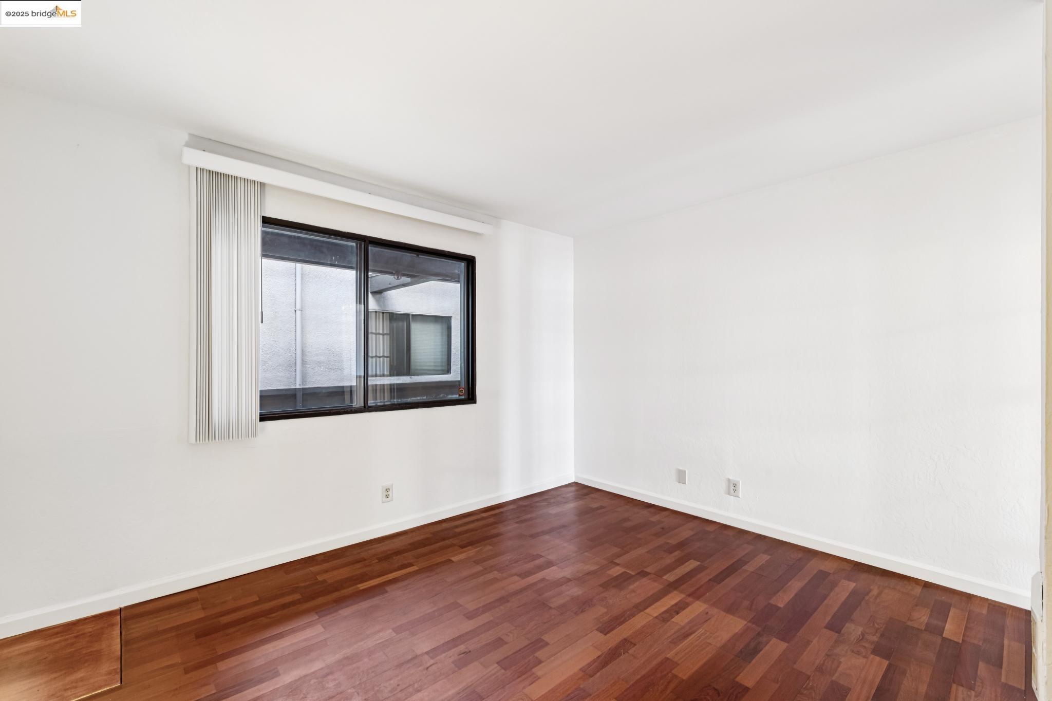 1 Embarcadero, Unit 161 Oakland, CA 94607 - Photo 28 of 31 Unfurnished room featuring dark wood-style floors