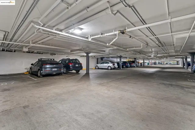 a view of parking garage with cars