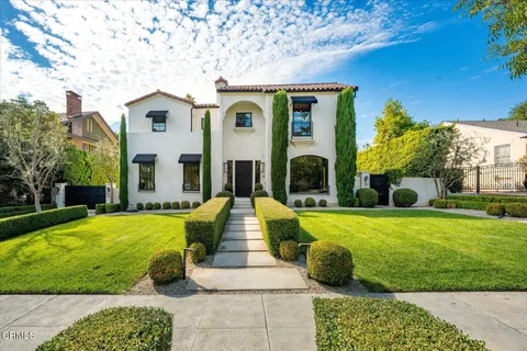 a front view of a house with swimming pool yard and outdoor seating