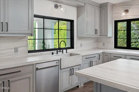 a bathroom with a sink a mirror and a vanity