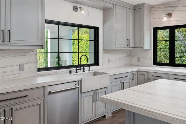a bathroom with a sink a mirror and a vanity
