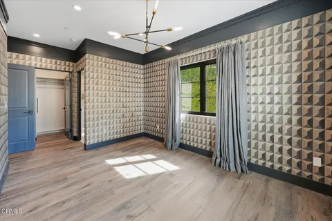 a spacious bathroom with a tub sink and mirror
