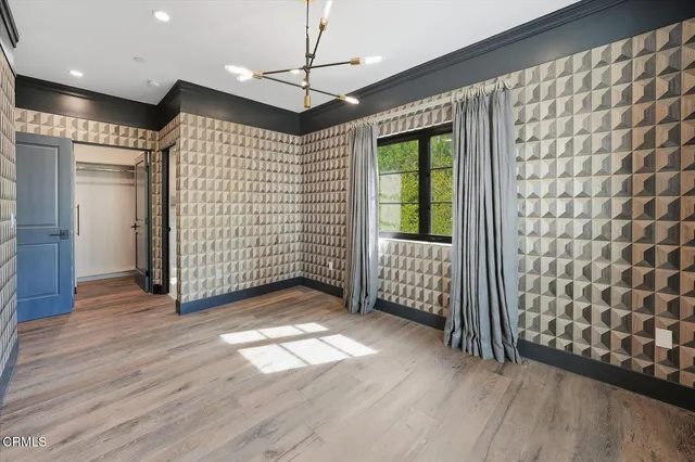 a spacious bathroom with a tub sink and mirror