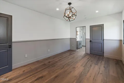 a view of a porch with a floor to ceiling windows and yard