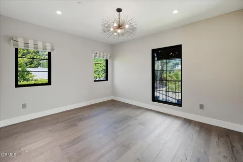 a view of a house with pool and a yard with furniture