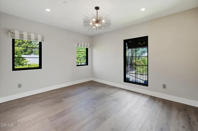 a view of a house with pool and a yard with furniture