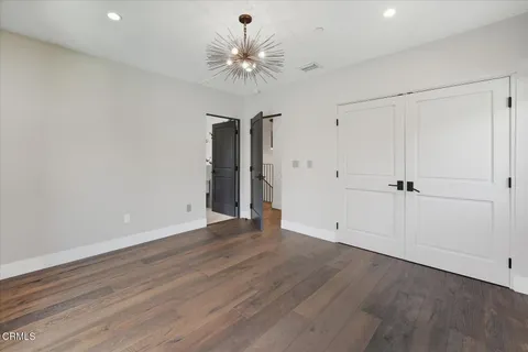 a view of a house with swimming pool and yard