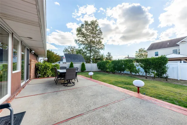 a view of a table and chairs in patio of the house