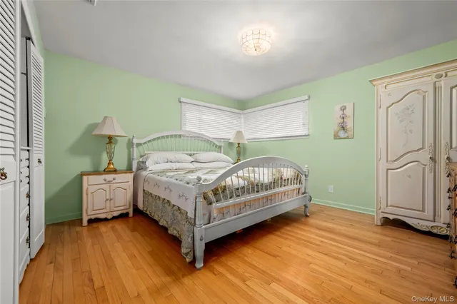 a bedroom with a bed and a table in it