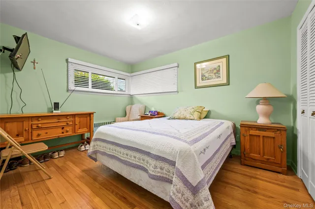 a bedroom with a bed and a table