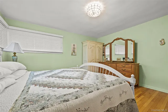 a bedroom with a bed and a window in it