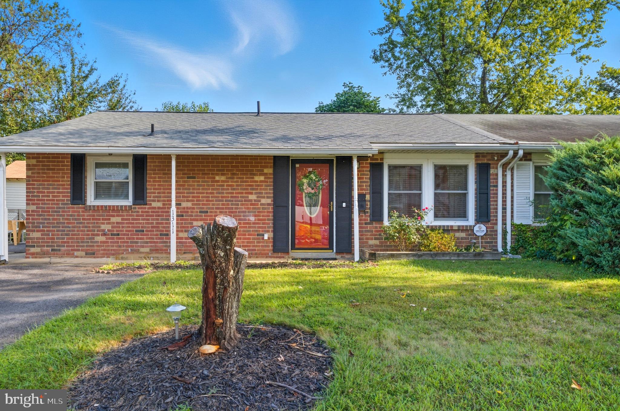 1311 Tenbrook Road Odenton, MD 21113 - Photo 1 of 37 a front view of a house with garden