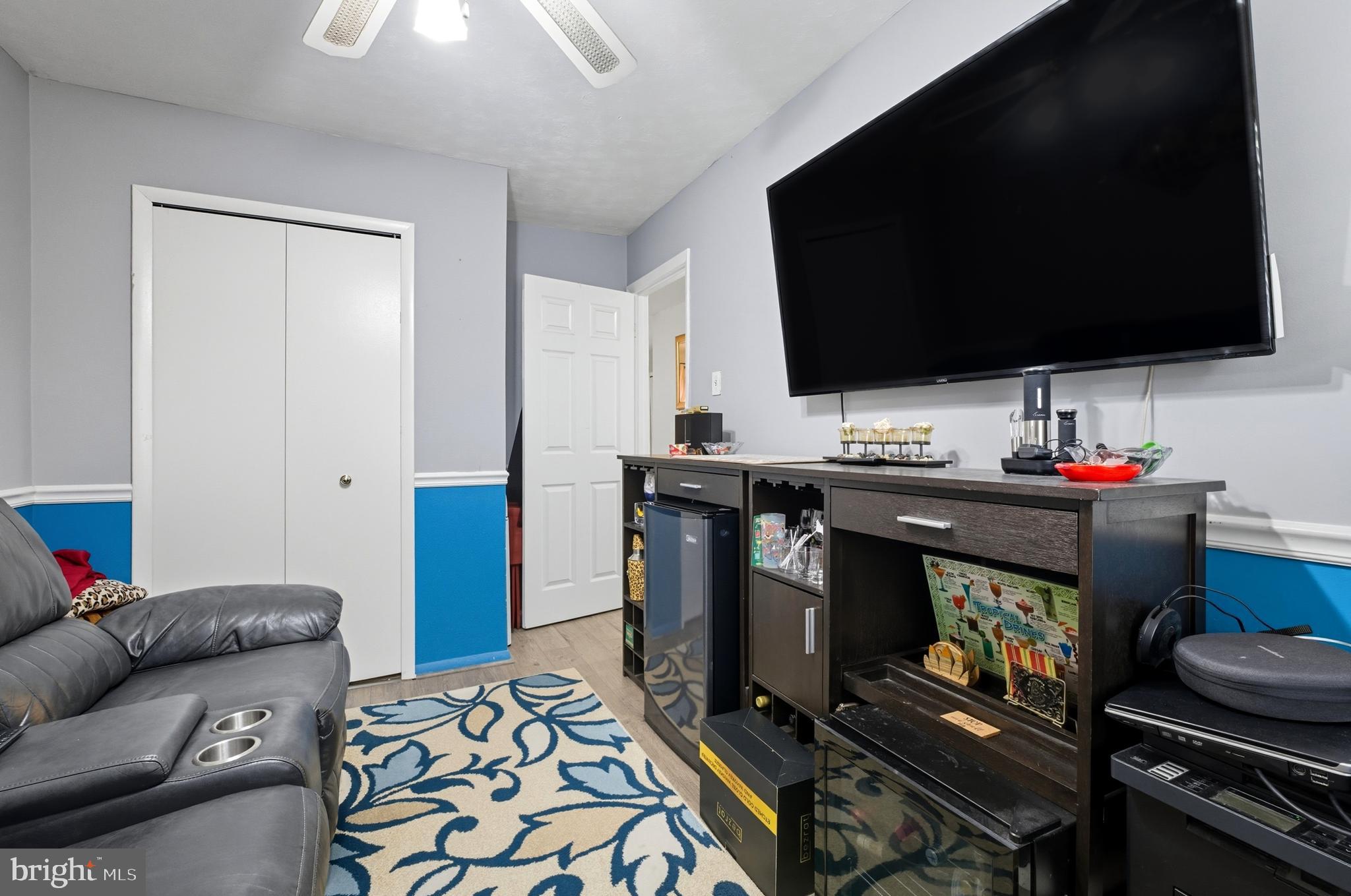 1311 Tenbrook Road Odenton, MD 21113 - Photo 11 of 37 a living room with furniture and a flat screen tv