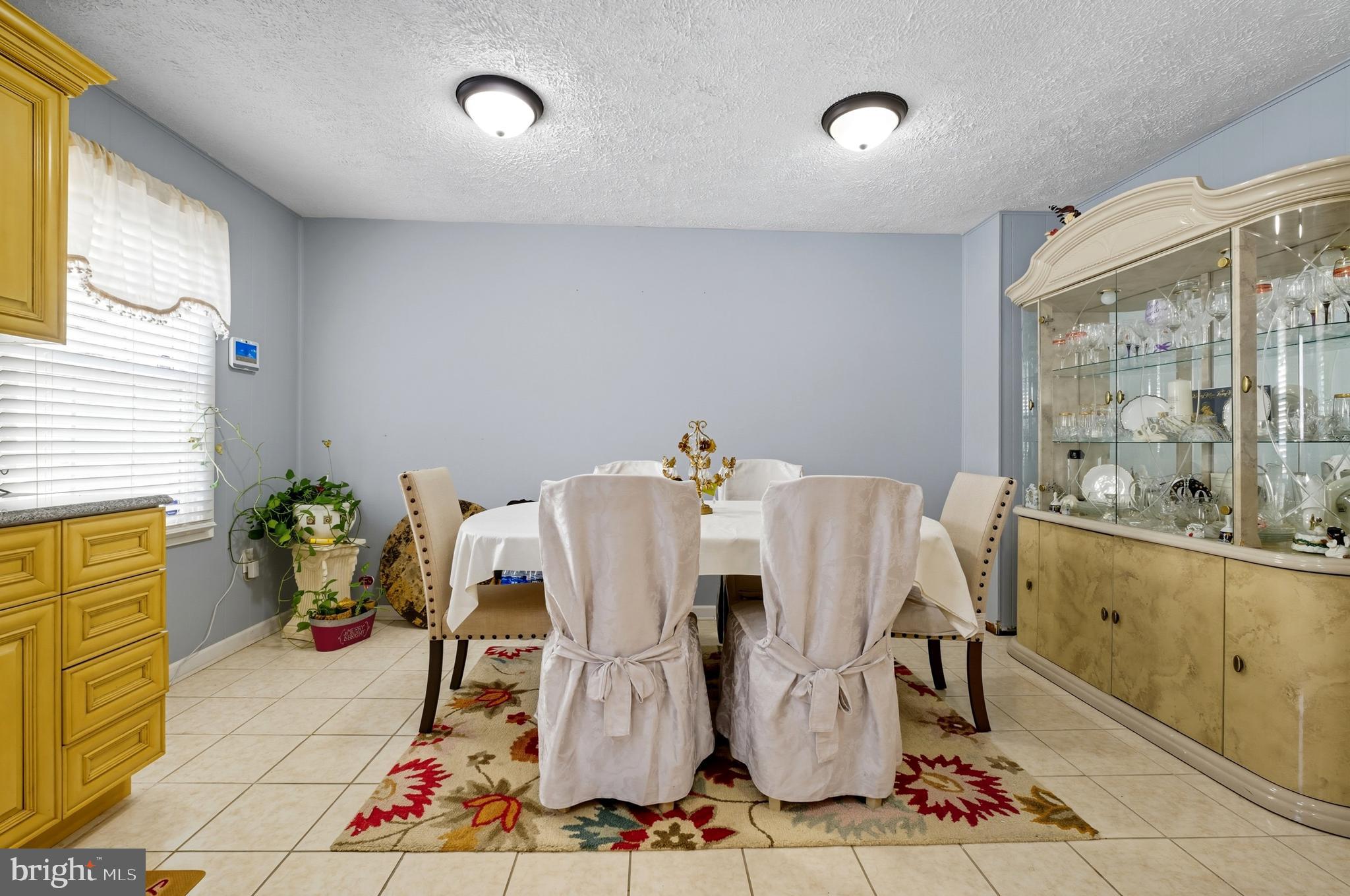 1311 Tenbrook Road Odenton, MD 21113 - Photo 15 of 37 a view of a dining room with furniture