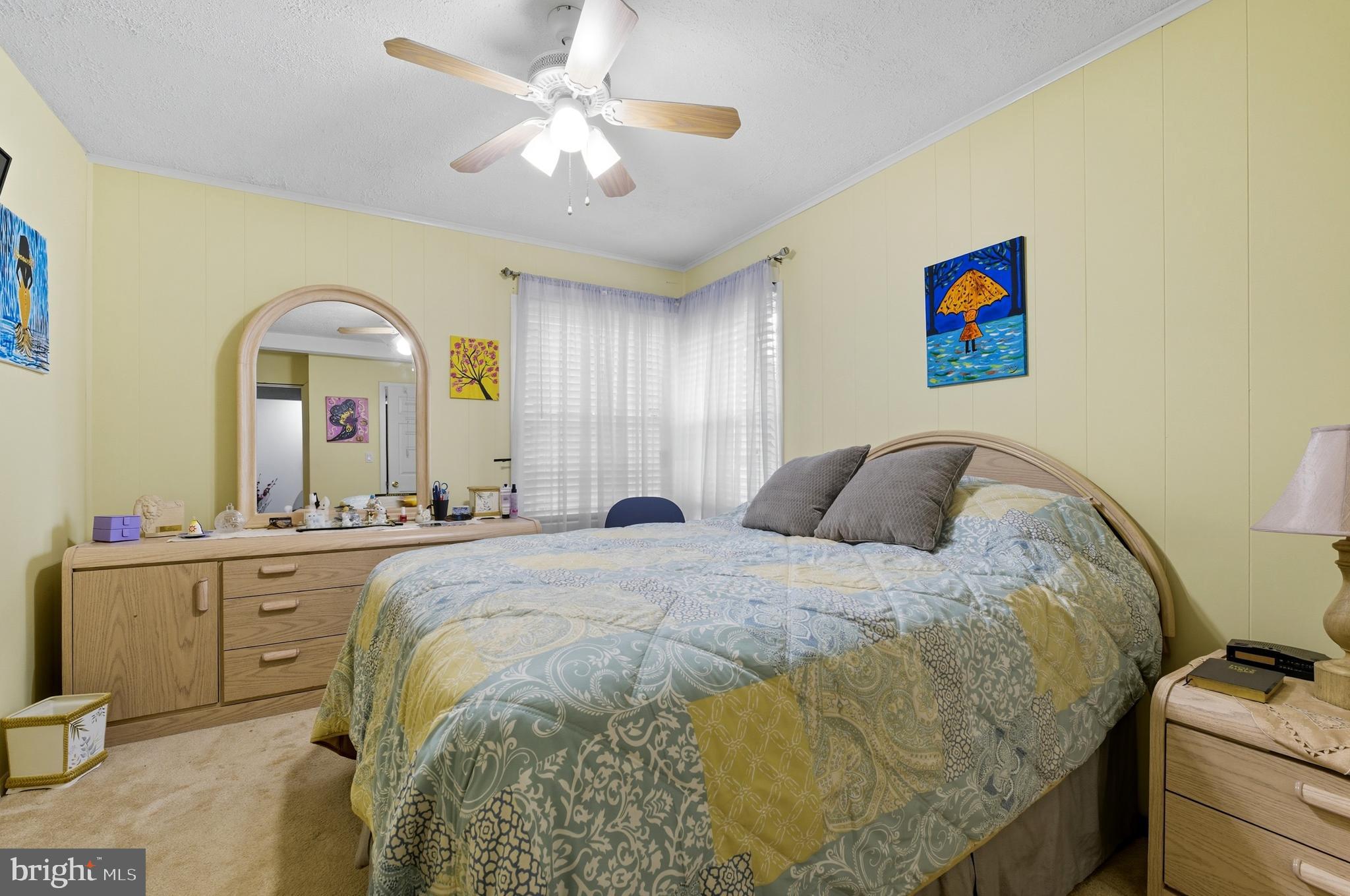 1311 Tenbrook Road Odenton, MD 21113 - Photo 20 of 37 a spacious bedroom with a bed and a chandelier