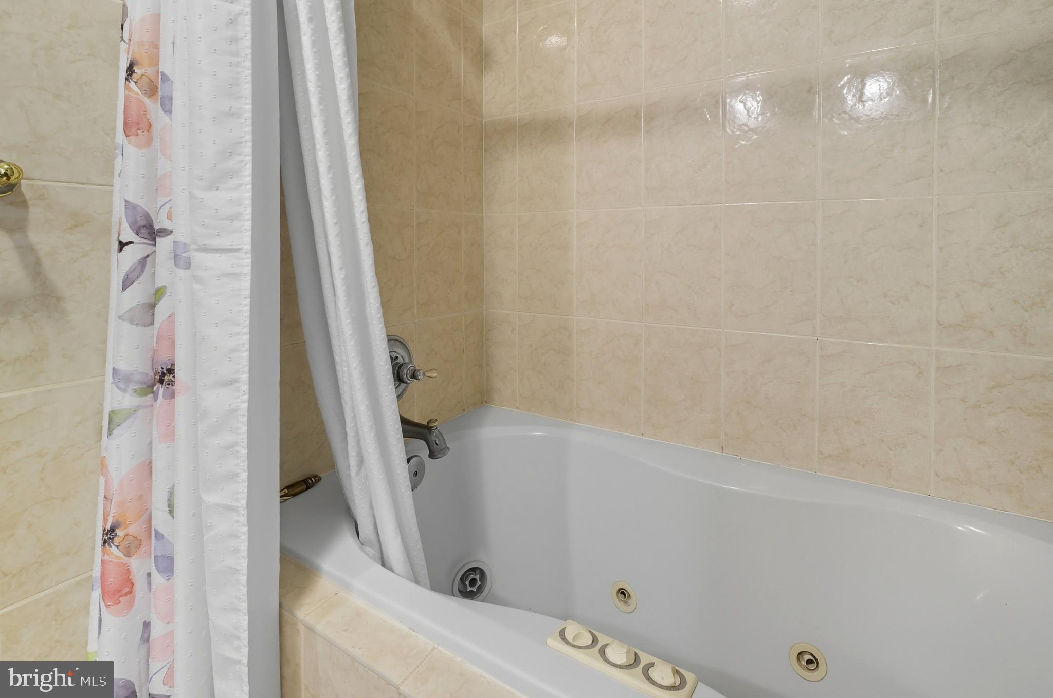 1311 Tenbrook Road Odenton, MD 21113 - Photo 26 of 37 a bathroom with a tub and shower