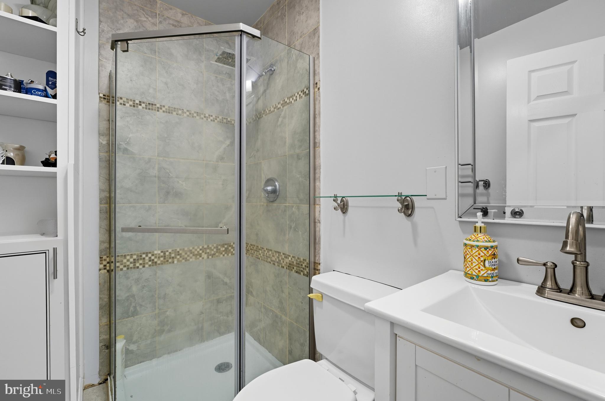 1311 Tenbrook Road Odenton, MD 21113 - Photo 32 of 37 a bathroom with a sink toilet and shower
