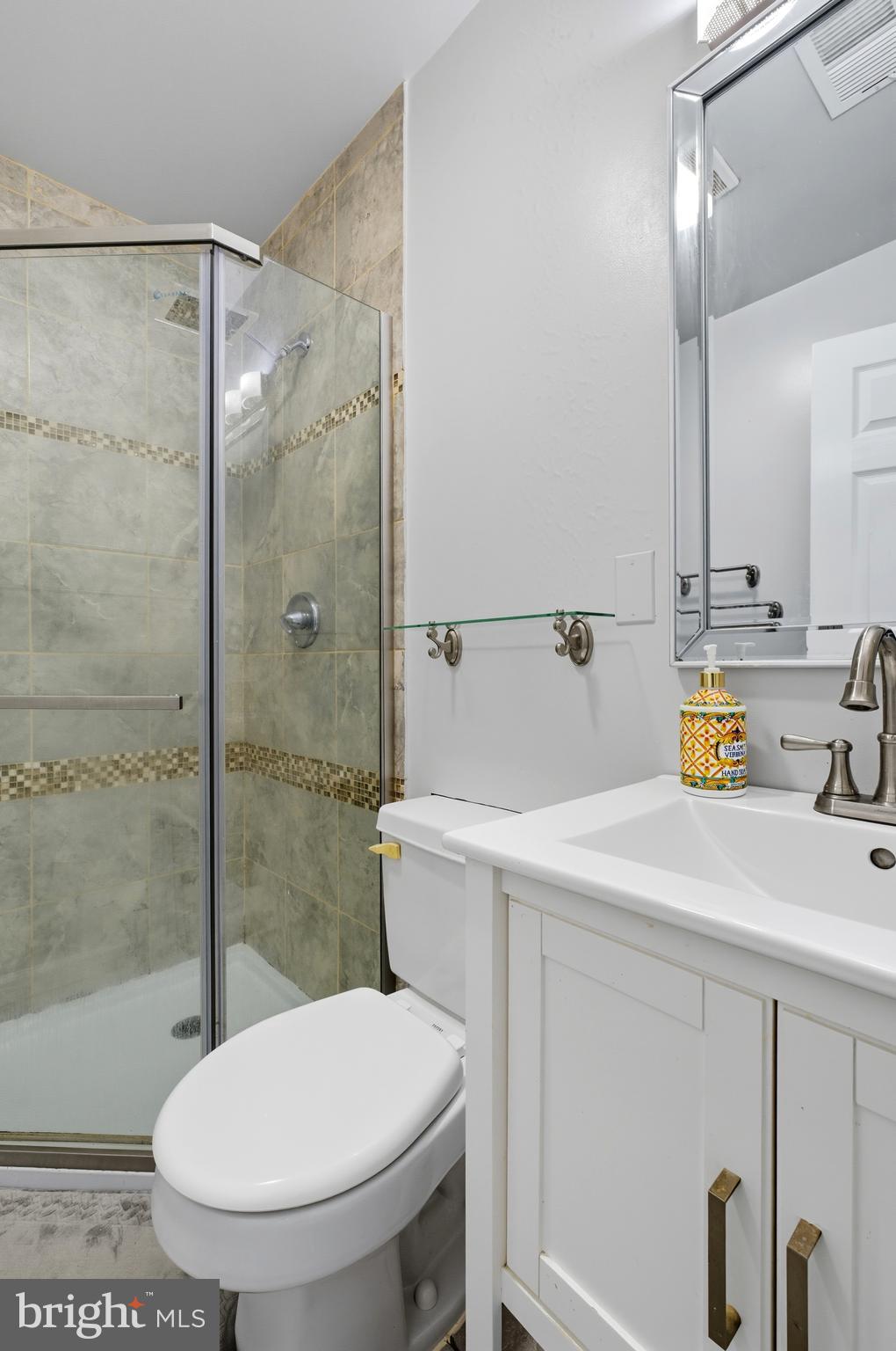 1311 Tenbrook Road Odenton, MD 21113 - Photo 33 of 37 a bathroom with a sink a toilet and shower