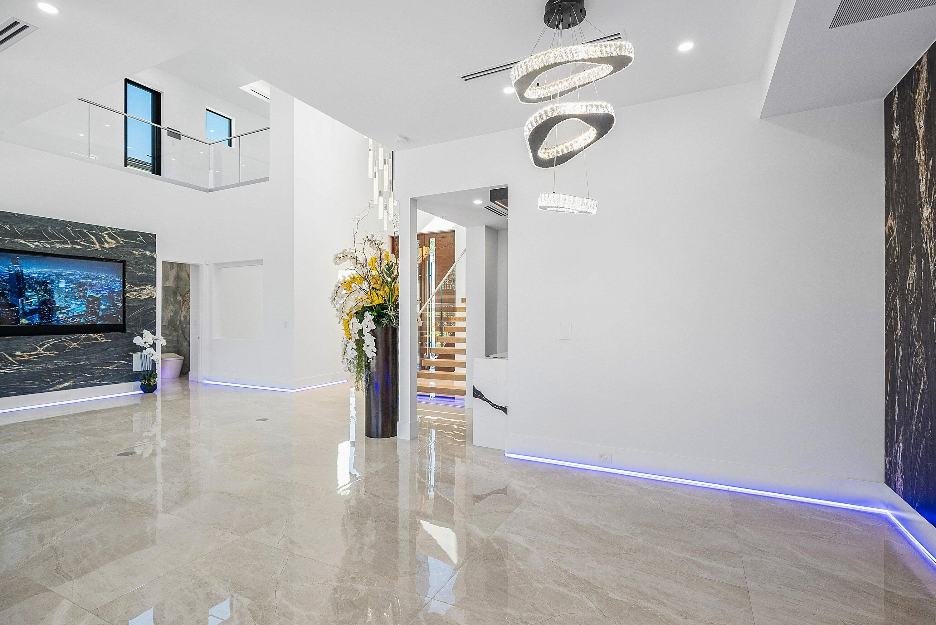 2650 Northeast 48th Court Lighthouse Point, FL 33064 - Photo 18 of 86 a view of a livingroom with furniture and a ceiling fan