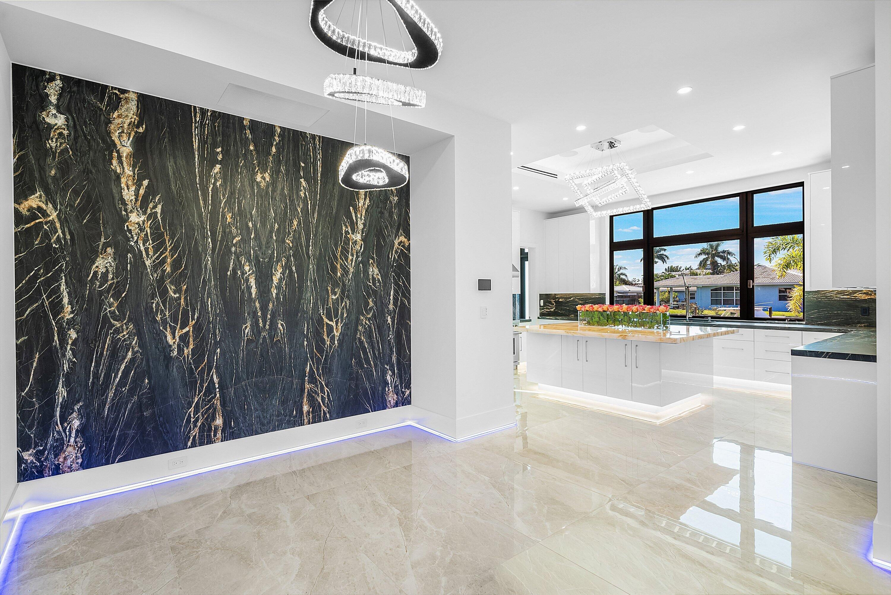 2650 Northeast 48th Court Lighthouse Point, FL 33064 - Photo 19 of 86 a living room with stainless steel appliances kitchen island granite countertop furniture and a view of living room
