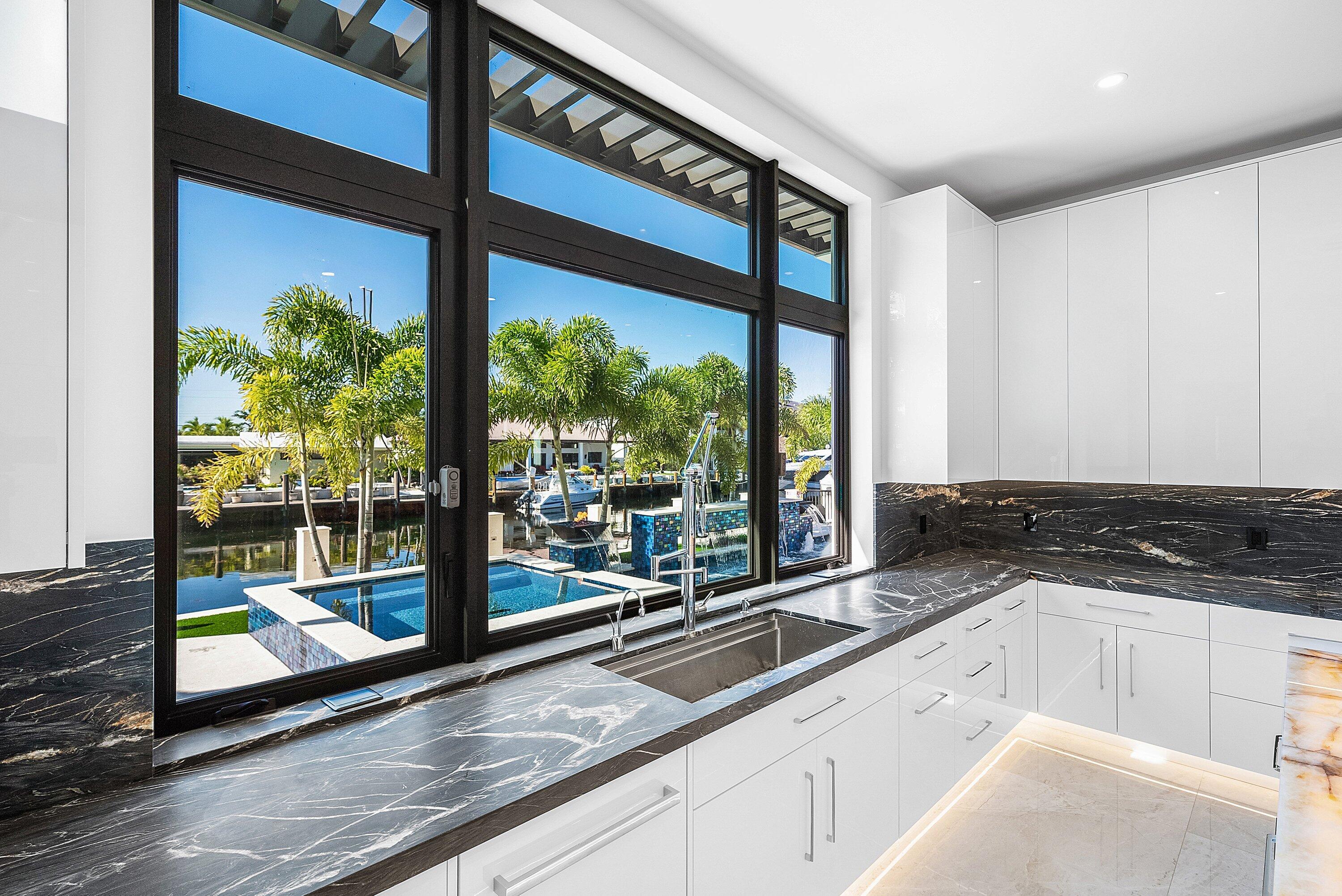 2650 Northeast 48th Court Lighthouse Point, FL 33064 - Photo 22 of 86 a view of a sink and window with an outdoor space