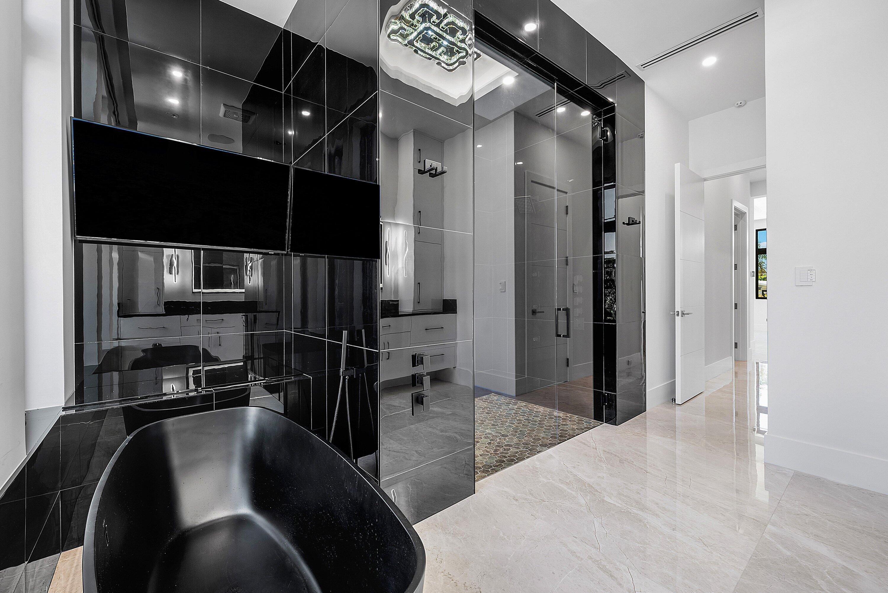 2650 Northeast 48th Court Lighthouse Point, FL 33064 - Photo 35 of 86 a kitchen with stainless steel appliances kitchen island granite countertop a refrigerator and a sink