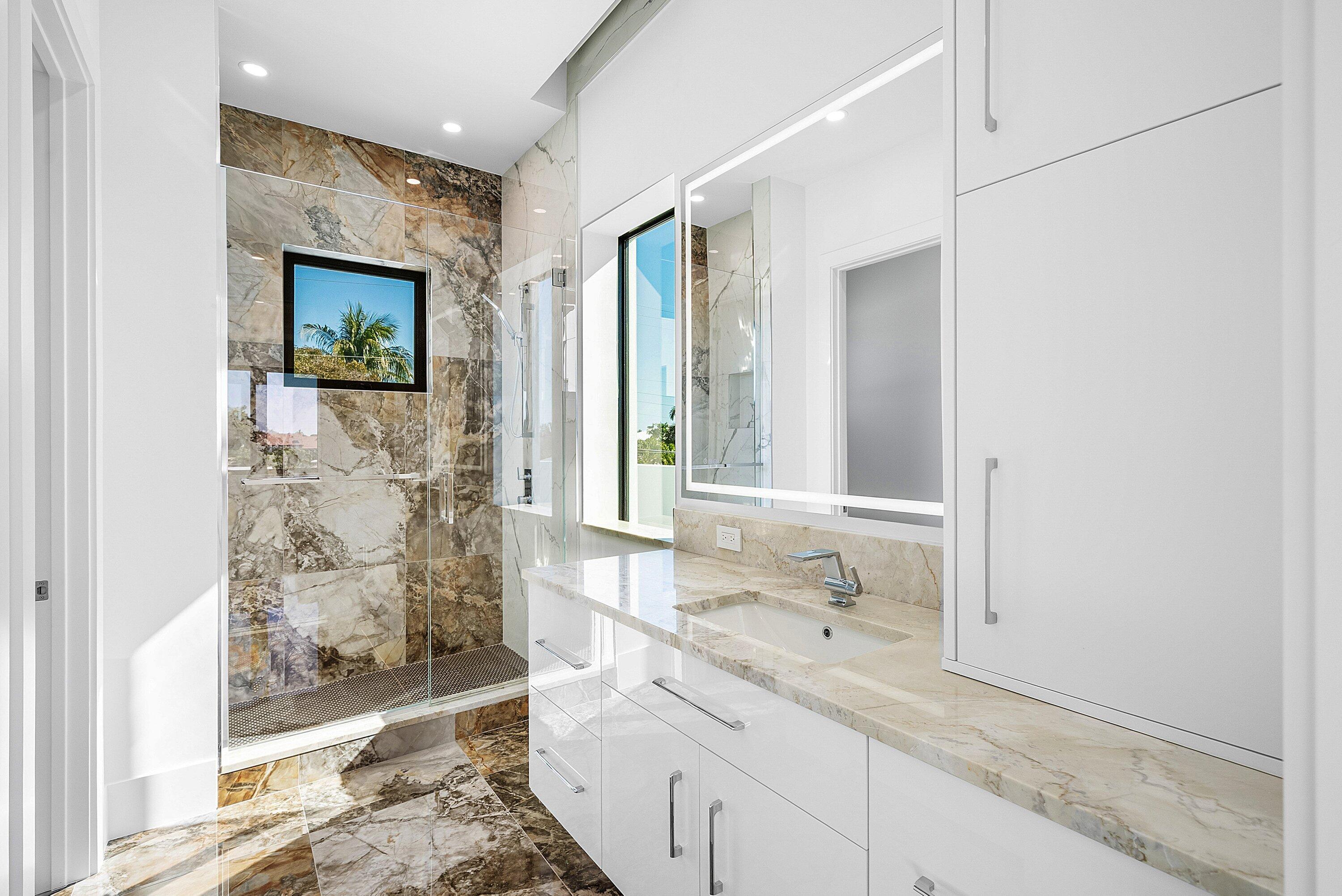 2650 Northeast 48th Court Lighthouse Point, FL 33064 - Photo 39 of 86 a bathroom with a granite countertop sink mirror and double