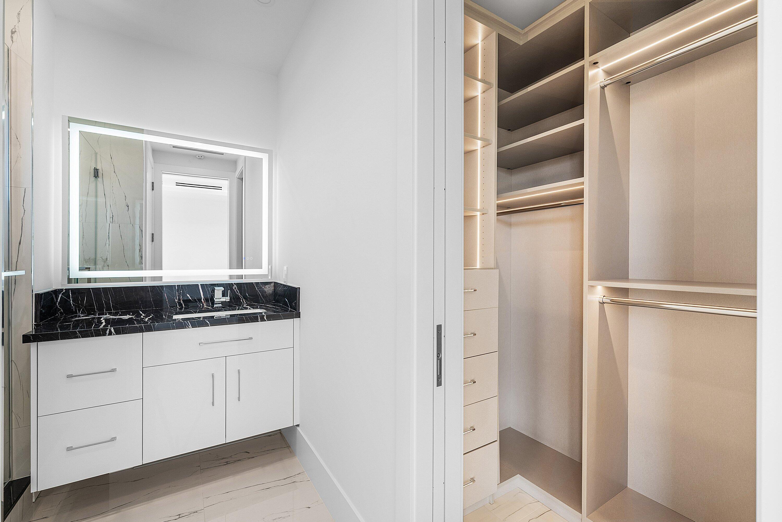 2650 Northeast 48th Court Lighthouse Point, FL 33064 - Photo 42 of 86 a bathroom with a granite countertop sink and a mirror