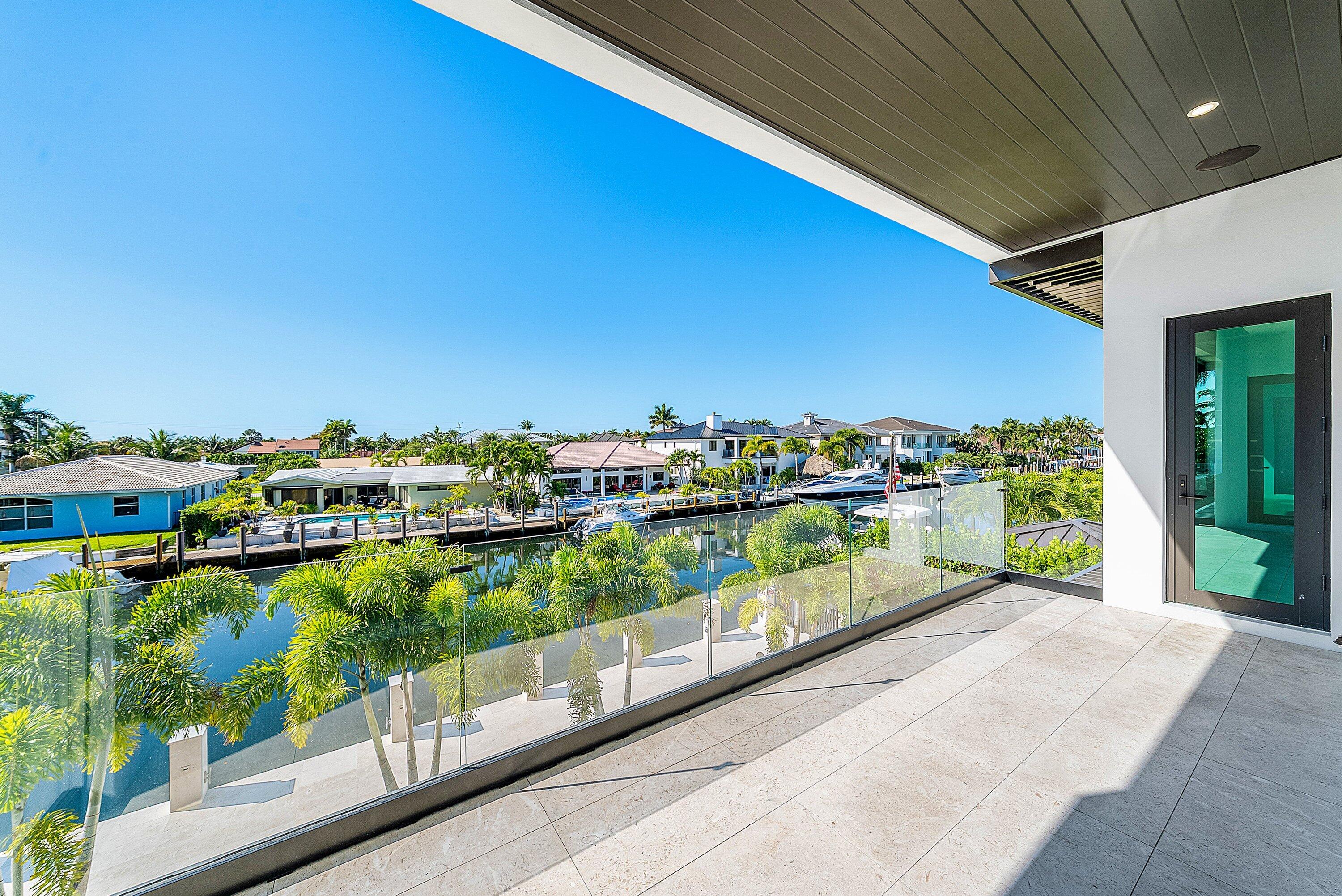 2650 Northeast 48th Court Lighthouse Point, FL 33064 - Photo 44 of 86 a view of swimming pool from a balcony