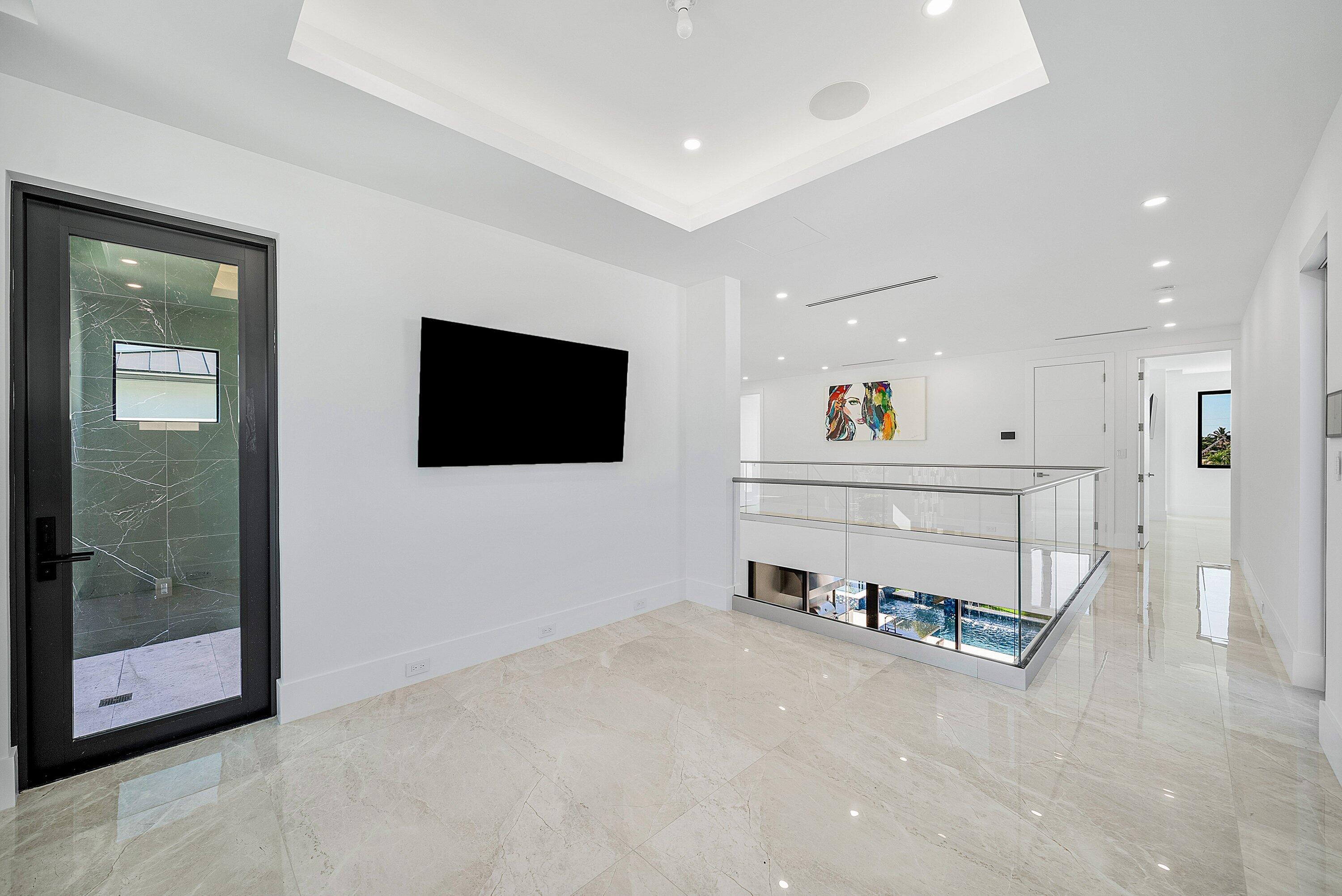 2650 Northeast 48th Court Lighthouse Point, FL 33064 - Photo 53 of 86 a living room with furniture and a flat screen tv