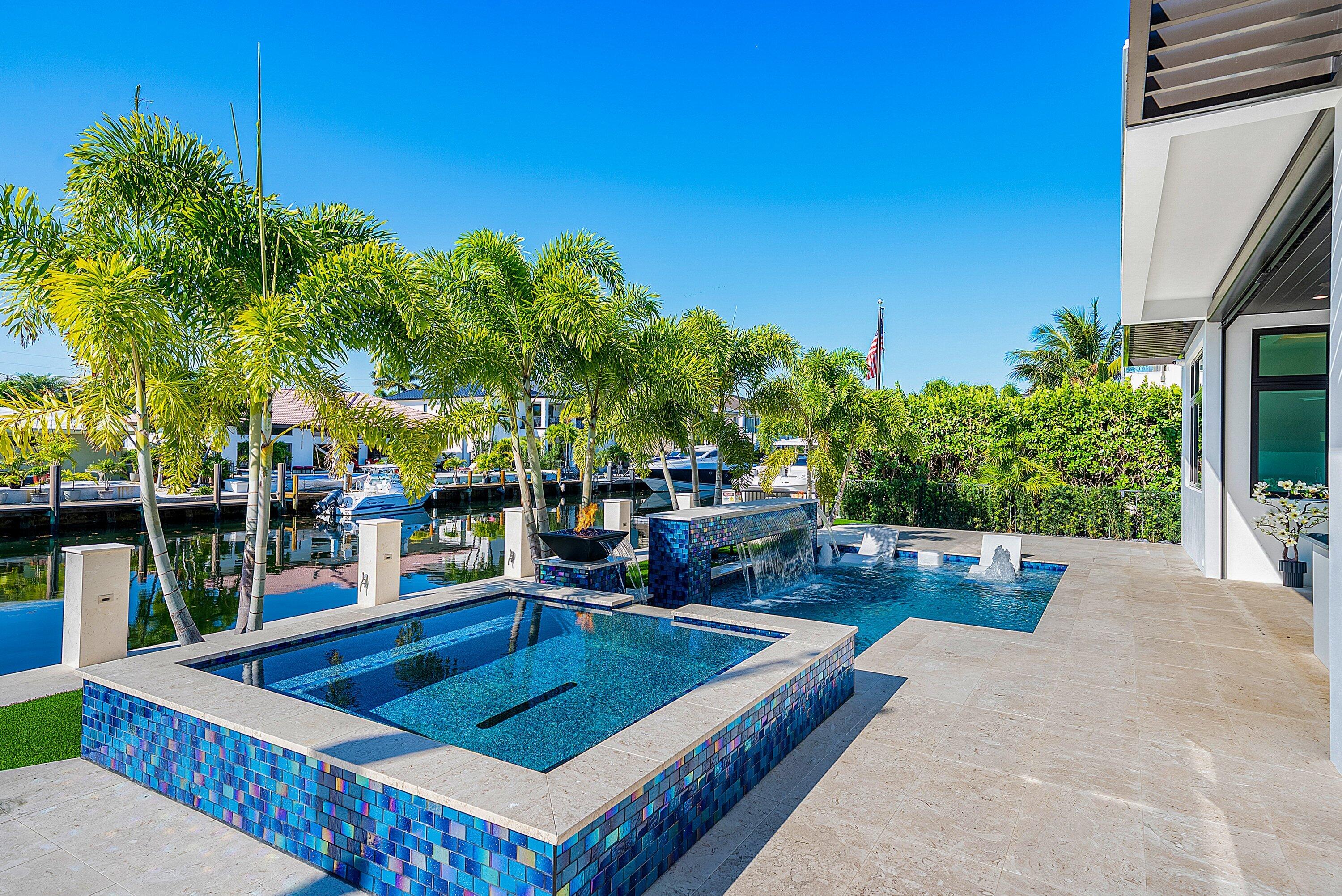 2650 Northeast 48th Court Lighthouse Point, FL 33064 - Photo 60 of 86 a view of a chairs and table in the patio