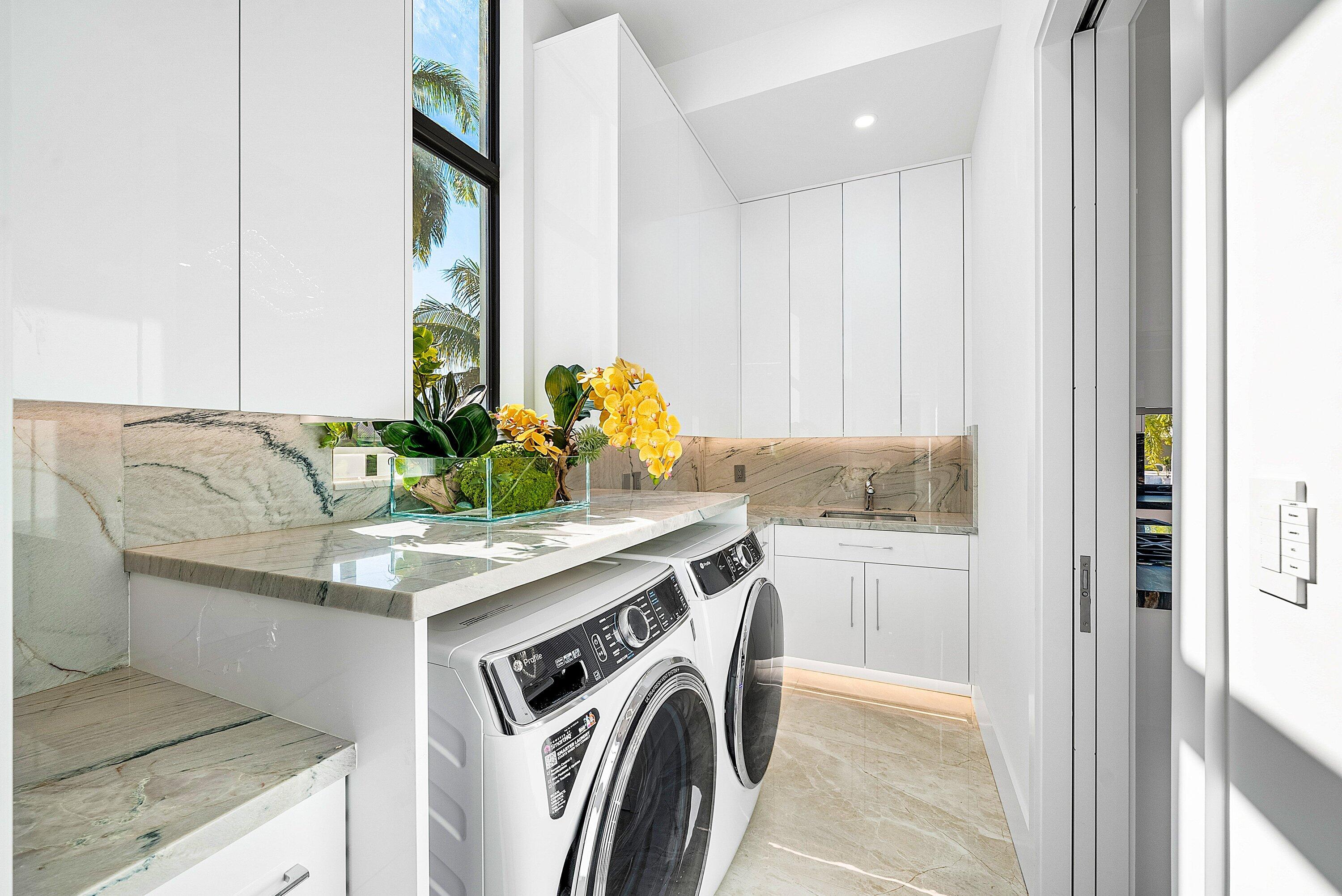 2650 Northeast 48th Court Lighthouse Point, FL 33064 - Photo 64 of 86 a utility room with washer and dryer